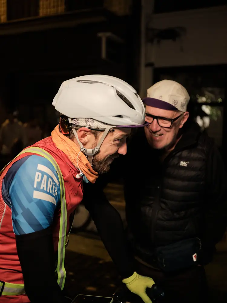 Tom Cooling greeted at the finish of the Lost Dot TransPyrenees at night